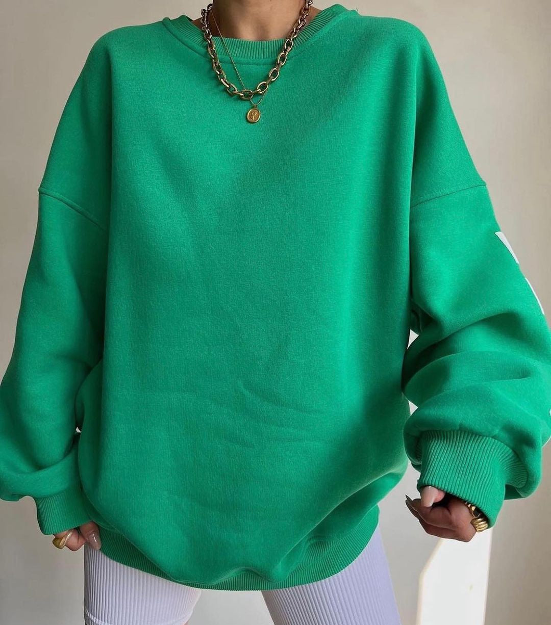 Marlen | Sweatshirt with striking green lettering on the sleeves