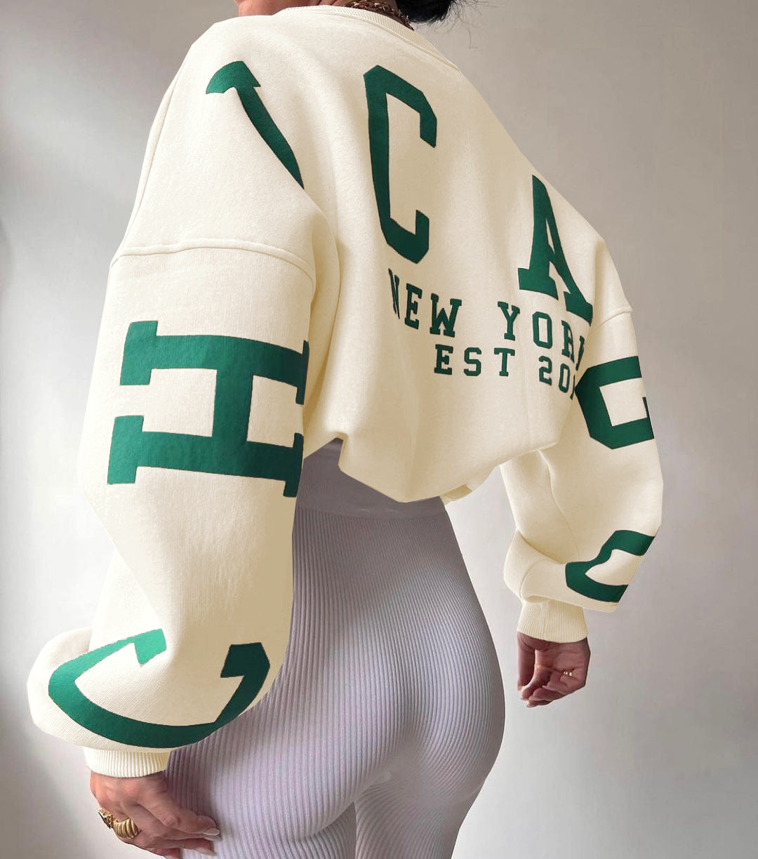 Marlen | Sweatshirt with striking green lettering on the sleeves
