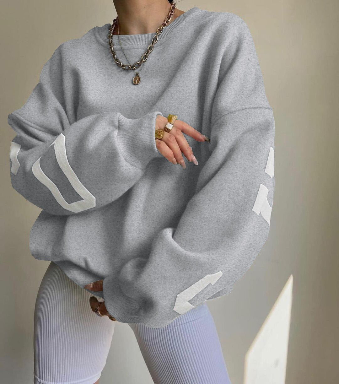 Marlen | Sweatshirt with striking green lettering on the sleeves