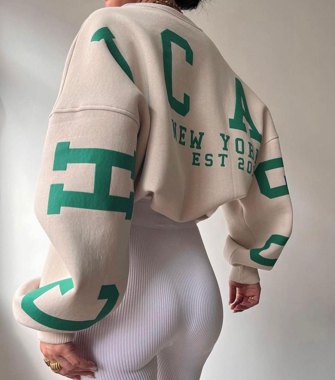 Marlen | Sweatshirt with striking green lettering on the sleeves