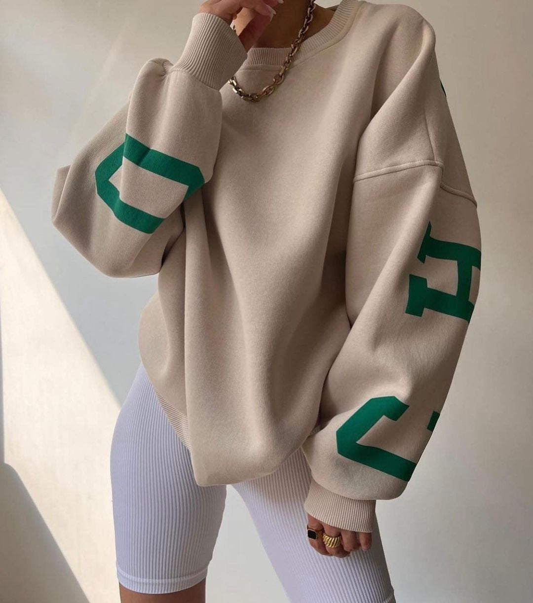 Marlen | Sweatshirt with striking green lettering on the sleeves