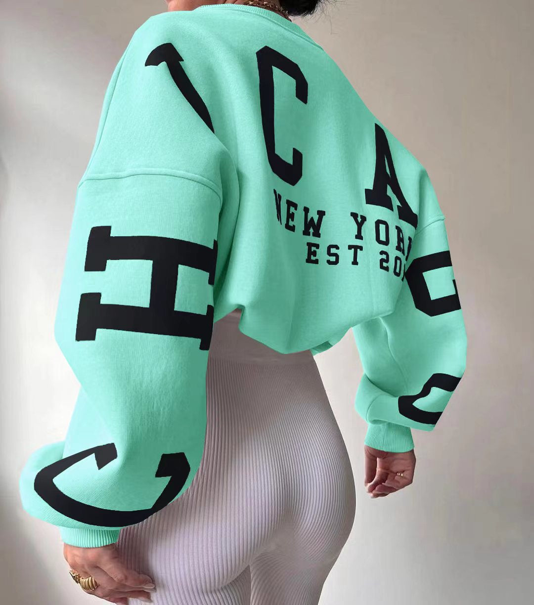 Marlen | Sweatshirt with striking green lettering on the sleeves