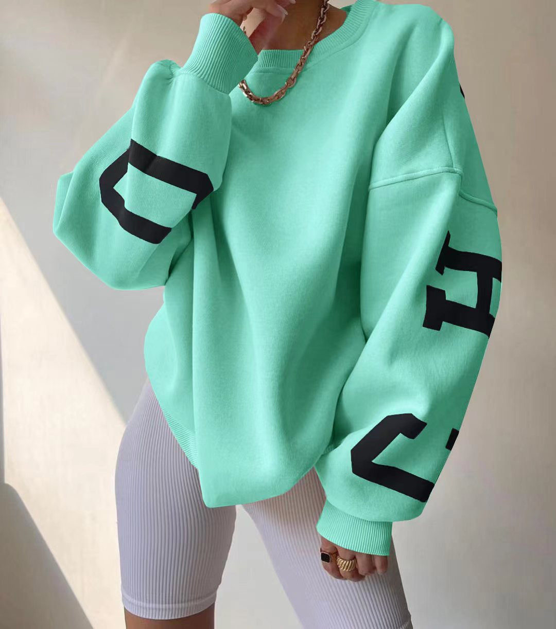 Marlen | Sweatshirt with striking green lettering on the sleeves