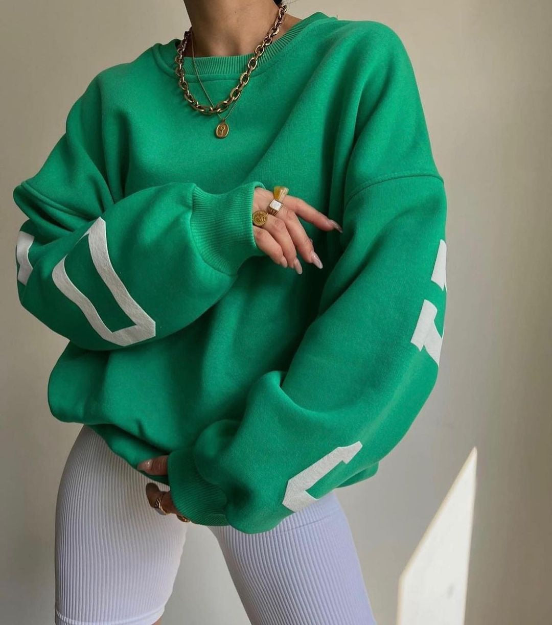 Marlen | Sweatshirt with striking green lettering on the sleeves