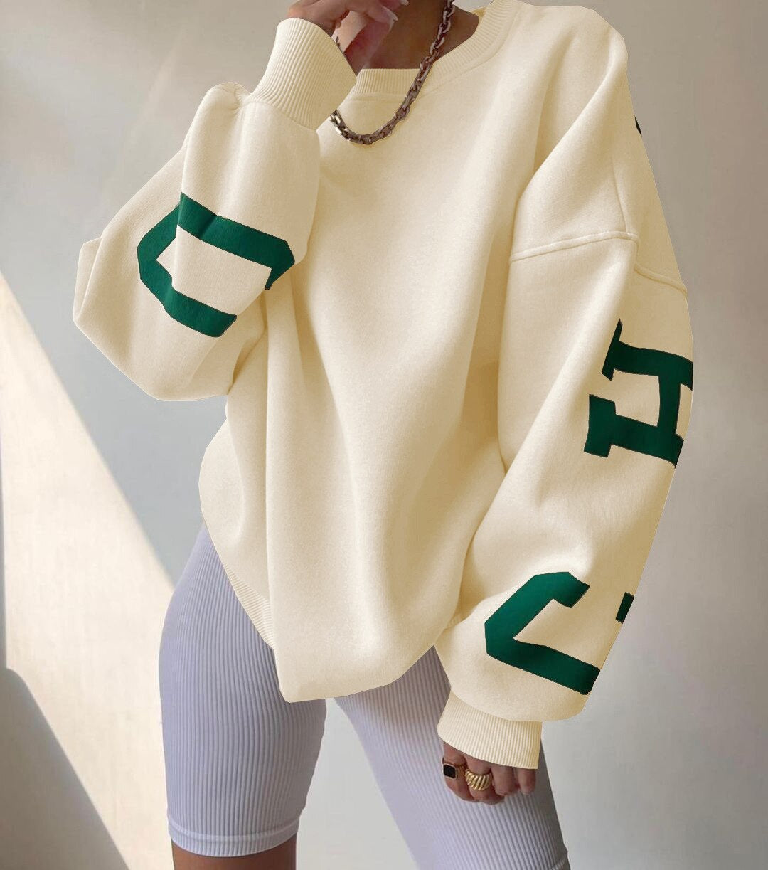 Marlen | Sweatshirt with striking green lettering on the sleeves