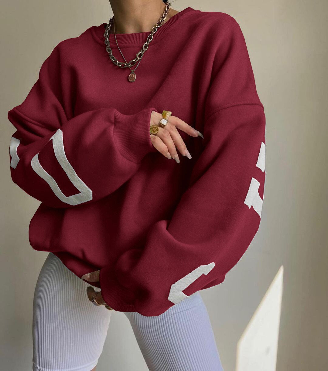 Marlen | Sweatshirt with striking green lettering on the sleeves